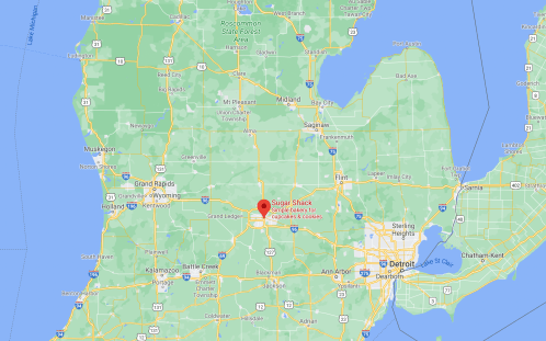 Map showing central Michigan with a marker for Sugar Shack, a bakery located near Detroit.