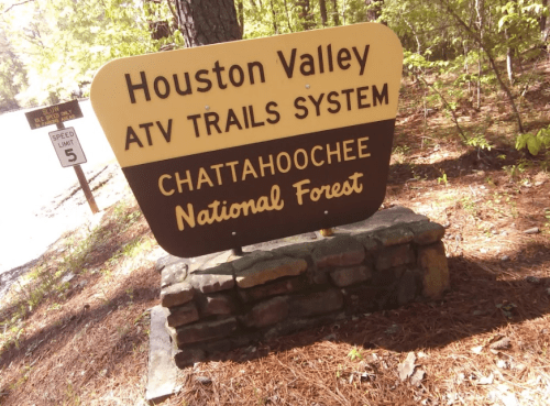 Sign for Houston Valley ATV Trails System in Chattahoochee National Forest, surrounded by trees and natural scenery.
