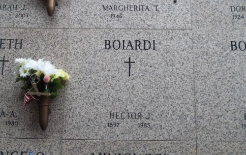 A granite memorial with the name "Boiardi," a cross, and flowers, honoring Hector J. (1897-1985).
