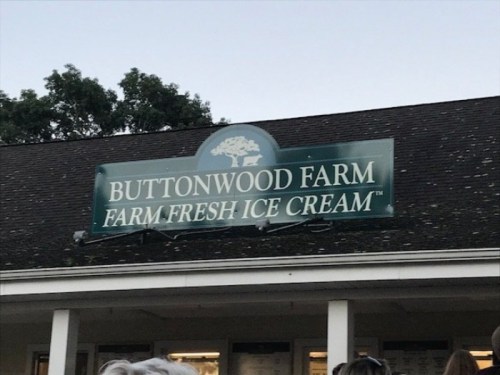 Sign for Buttonwood Farm, advertising farm fresh ice cream, with a tree logo above the text.