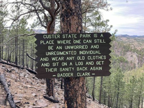 Sign at Custer State Park promoting relaxation and nature, encouraging visitors to unwind and reconnect with themselves.