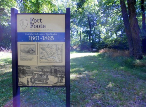 Sign for Fort Foote, detailing Civil War defenses of Washington (1861-1865), surrounded by trees and grassy area.