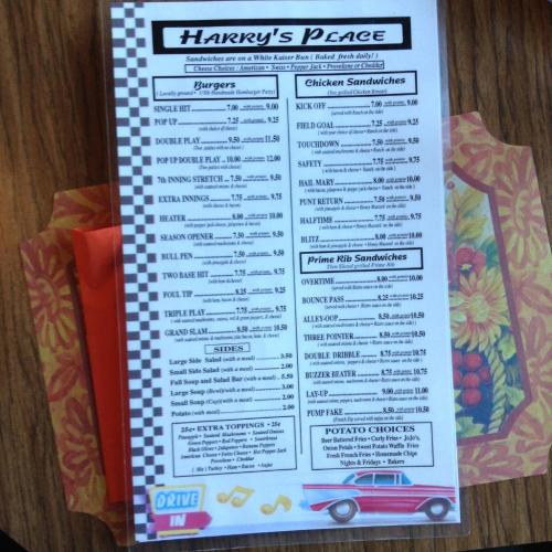 Menu for Harry's Place featuring burgers, chicken sandwiches, prime rib sandwiches, sides, and potato choices.