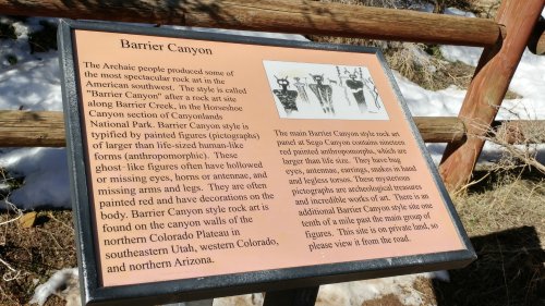 Sign describing Barrier Canyon rock art, featuring anthropomorphic figures and their significance in the region's history.