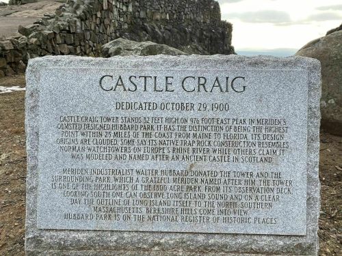A stone plaque detailing the history of Castle Craig, dedicated on October 29, 1900, in Meriden, Connecticut.