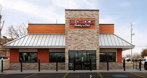 Exterior view of a Red Rock Bakery & Deli building with a modern design and stone accents.