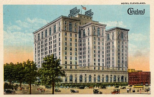 Historic postcard of Hotel Cleveland, featuring a large building with trees and vintage cars in front.