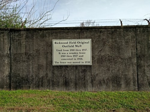 Sign on a wall detailing the history of Rickwood Field's original outfield wall, used from 1910 to 1937.