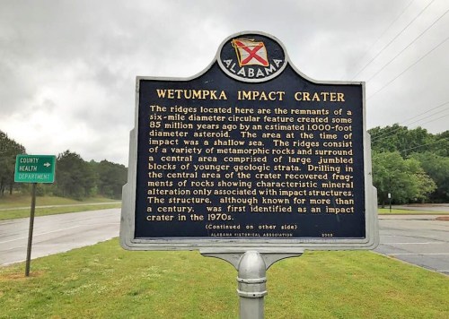 Sign detailing the Wetumpka Impact Crater, describing its geological features and historical significance.