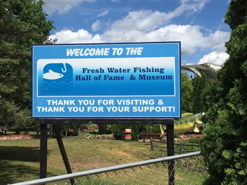 Sign welcoming visitors to the Fresh Water Fishing Hall of Fame & Museum, thanking them for their support.