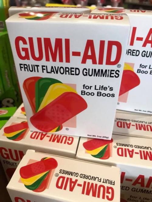 A box of Gumi-Aid fruit-flavored gummies, designed for kids, featuring colorful gummy band-aids on the packaging.