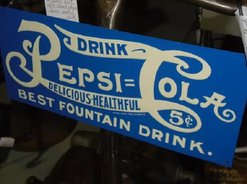 Vintage Pepsi-Cola sign promoting the drink as delicious and healthy, priced at 5 cents.