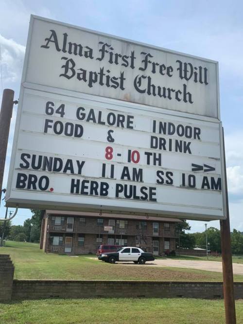 Sign for Alma First Free Will Baptist Church advertising an event with food and drink, and service times.