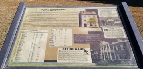 Historical marker detailing the Franklin and Armfield Company, including information on slave dealers and a reward notice.