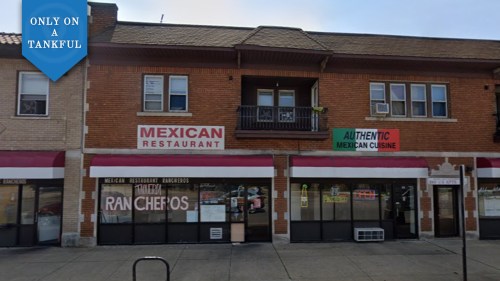 A brick building featuring two Mexican restaurants with signs for "Mexican Restaurant" and "Authentic Mexican Cuisine."