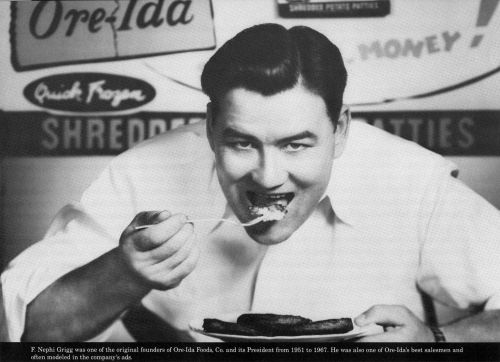 A man eating a plate of food, with vintage Ore-Ida branding in the background.