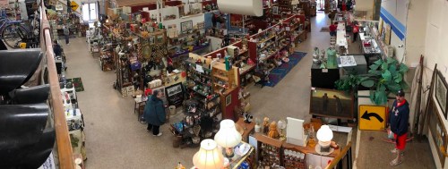 Aerial view of a bustling antique store filled with various items, including furniture, decor, and collectibles.