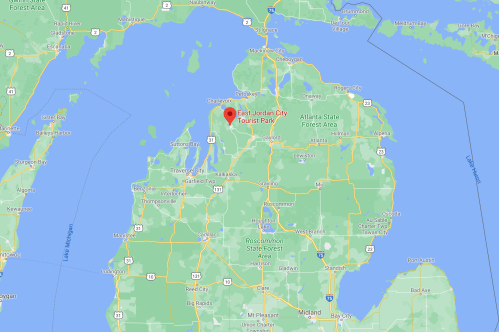 Map showing East Jordan City Tourist Park in Michigan, with surrounding roads and geographical features.