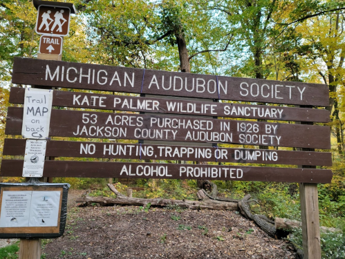Sign for the Michigan Audubon Society's Kate Palmer Wildlife Sanctuary, detailing rules and history of the area.