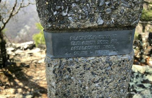 Signpost at Blackrock Summit, elevation 2,902 ft, marking the Appalachian Trail directions: South and North.