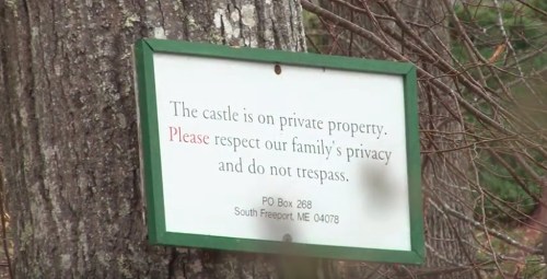 Sign on a tree stating "The castle is on private property. Please respect our family's privacy and do not trespass."