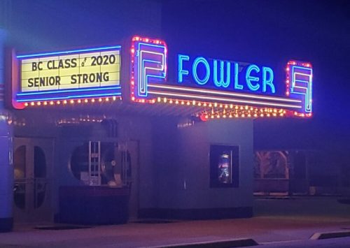 Neon-lit marquee of the Fowler Theater at night, displaying "BC Class of 2020 Senior Strong."