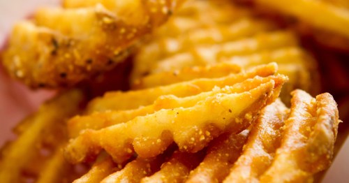 Close-up of crispy, seasoned waffle fries, a customer favorite at Ebeneezer’s in Minot.