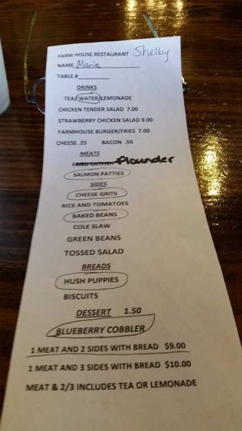 A restaurant menu with items listed, including drinks, salads, meats, sides, and dessert options.