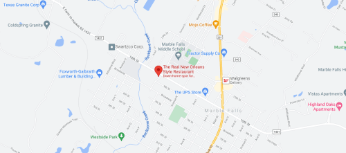 Map showing Marble Falls, Texas, highlighting "The Real New Orleans Style Restaurant" and nearby landmarks.