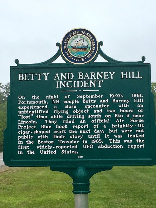 Sign detailing the Betty and Barney Hill incident, a notable UFO abduction case from 1961 in Portsmouth, NH.