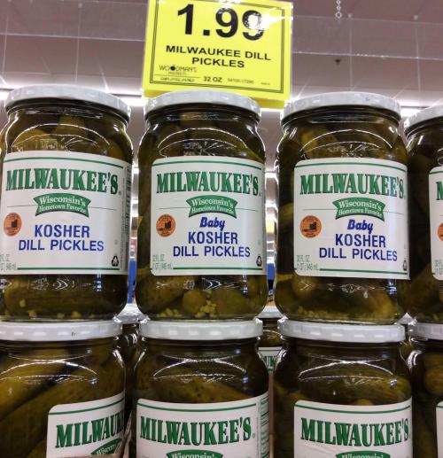 Jars of Milwaukee's Baby Kosher Dill Pickles on display, priced at $1.99 each.