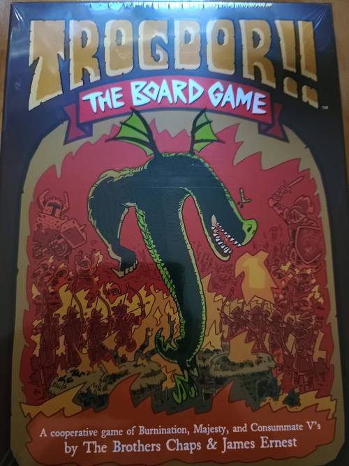 Cover of "Trogdor!! The Board Game," featuring a dragon and medieval characters in a fiery background.