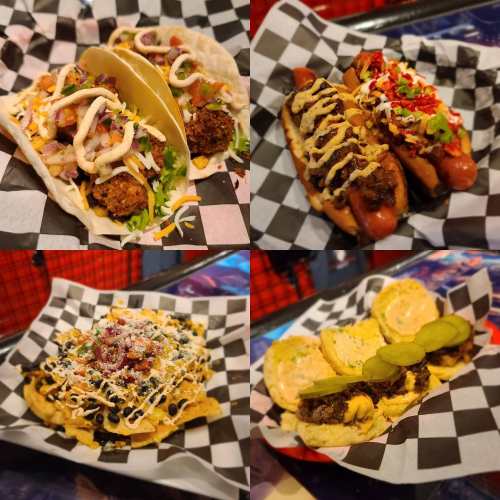 A collage of delicious tacos, hot dogs, nachos, and sliders on checkered paper plates.