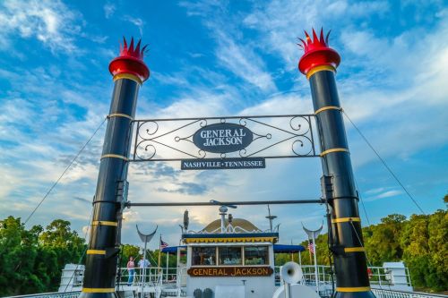 The General Jackson riverboat in Nashville, Tennessee, with a blue sky and trees in the background.