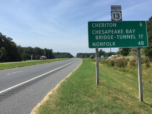 Road sign indicating distances to Cheriton (6 miles), Chesapeake Bay Bridge-Tunnel (17 miles), and Norfolk (48 miles).