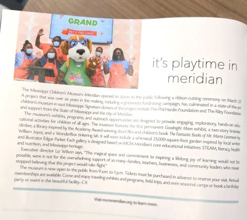 A ribbon-cutting ceremony at the Mississippi Children's Museum-Meridian, featuring staff and a mascot celebrating the opening.