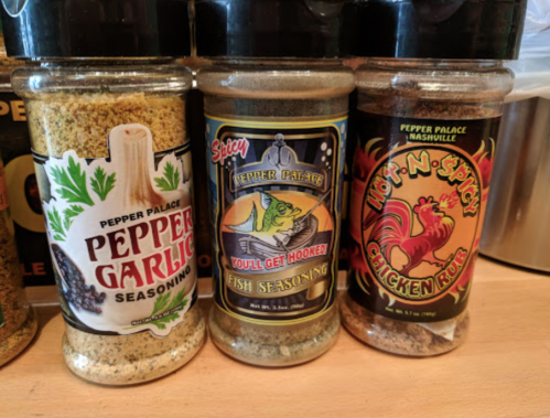 Three jars of seasoning: Pepper Garlic, Fish Seasoning, and Hot 'N Spicy Chicken Rub, all from Pepper Palace.