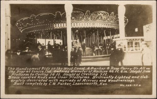 Historic photo of a carousel at Venice Pier, showcasing its ornate design and vibrant lights. C.W. Parker, Leavenworth, Kan.