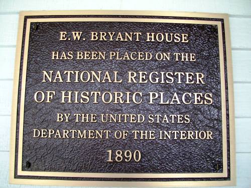 Plaque indicating the E.W. Bryant House is on the National Register of Historic Places, established in 1890.