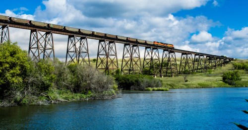 A freight train crosses the high iron trestles of the Hi-Line Railroad Bridge over the Sheyenne River.