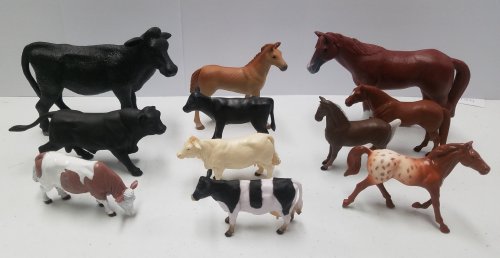 A collection of toy farm animals, including cows and horses, arranged in two rows on a white surface.