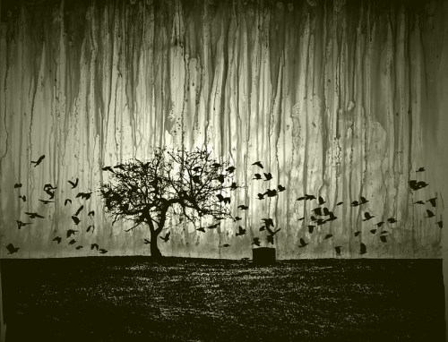 Silhouette of a tree and flying birds against a textured, rain-streaked background in muted green tones.
