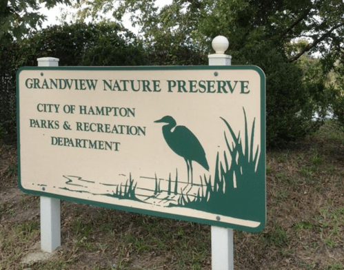 Sign for Grandview Nature Preserve, City of Hampton Parks & Recreation Department, featuring a heron and natural scenery.