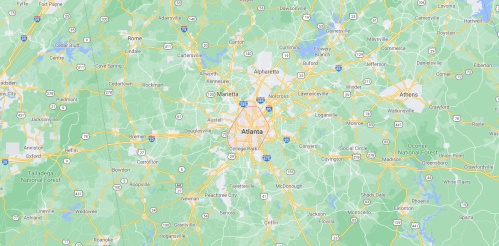 Map of the Atlanta metropolitan area, showing roads, cities, and surrounding regions in green and light colors.