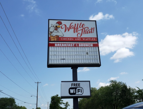 Sign for "Waffle That!" featuring chicken and waffles, advertising breakfast and brunch, with a "Free Wi-Fi" notice below.