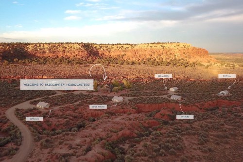 Aerial view of Basecamp37 headquarters with labeled buildings and surrounding desert landscape at sunset.