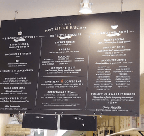 Menu board featuring biscuit sandwiches, daily specials, and coffee options at Callie's Hot Little Biscuit.