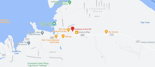 Map showing Cottonwood Shores area with restaurants, a coffee shop, and nearby landmarks along the water.