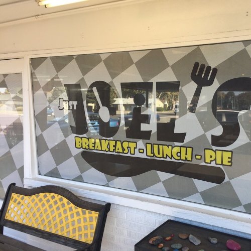 Window display of "Just Joel's" featuring the words "Breakfast - Lunch - Pie" in a playful, colorful design.