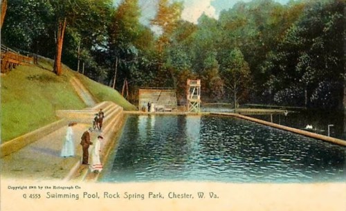 Vintage postcard of a swimming pool at Rock Spring Park, Chester, West Virginia, surrounded by trees and a diving tower.